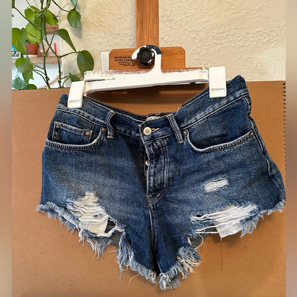 Free People. Denim shorts. Size 26. Relaxed fit & distressed. Medium dye denim.